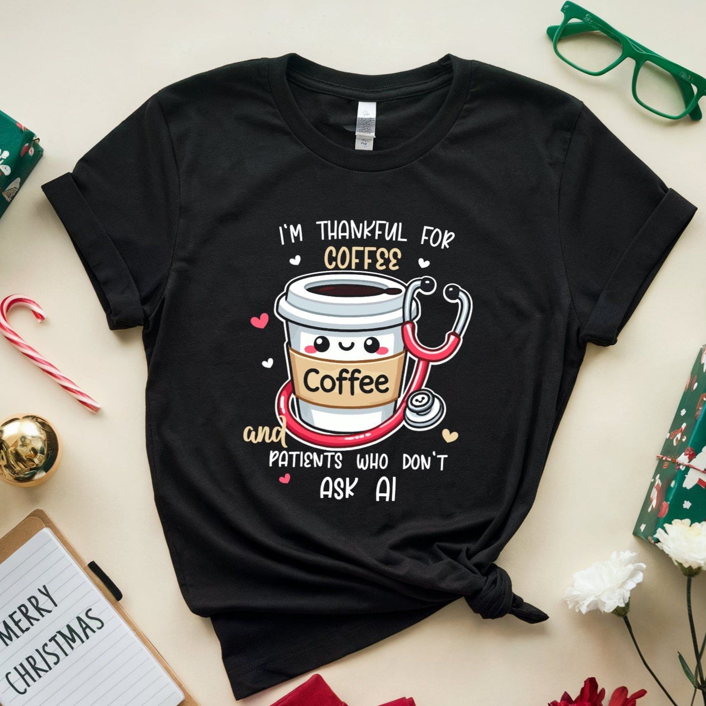 Black t-shirt with coffee-themed design tshirt with the words 'I'm thankful for coffee and patients who don't ask AI' a funny thanksgiving gift for doctors, nurses or medical students on a festive background with presents and flowers.