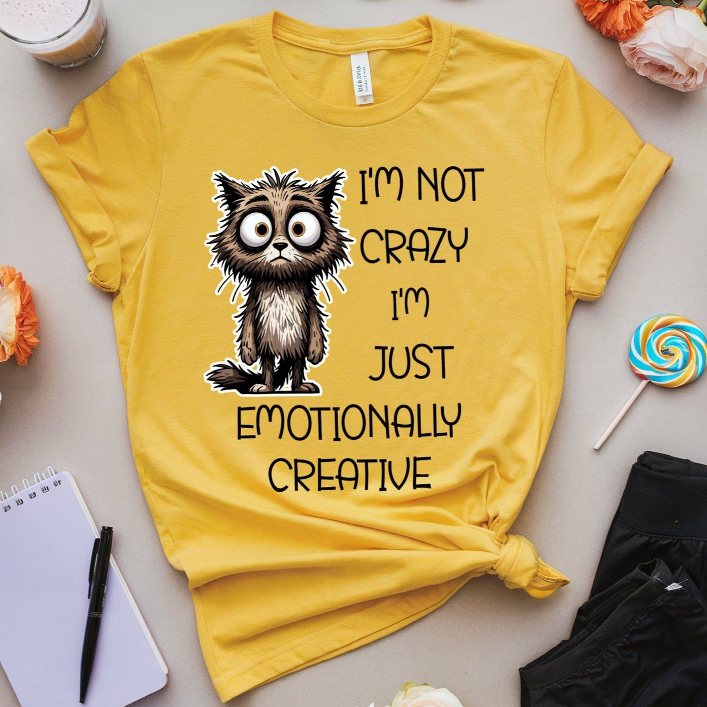 Yellow t-shirt with a cat graphic for mental health that is sarcastic.
