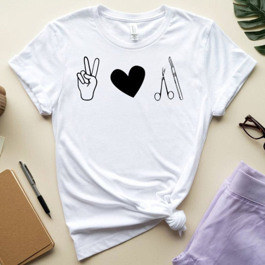 White t-shirt for surgeons with symbols on a beige surface with accessories