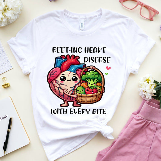 White t-shirt with a heart and vegetables graphic and text on a light surface with accessories.
