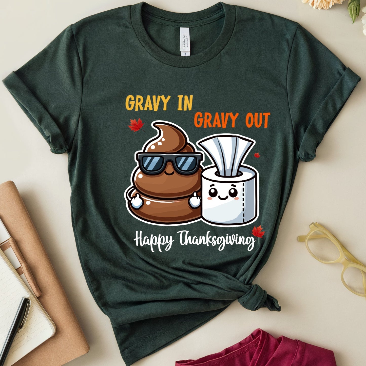Green t-shirt with humorous Thanksgiving-themed design about poop and tissue paper.