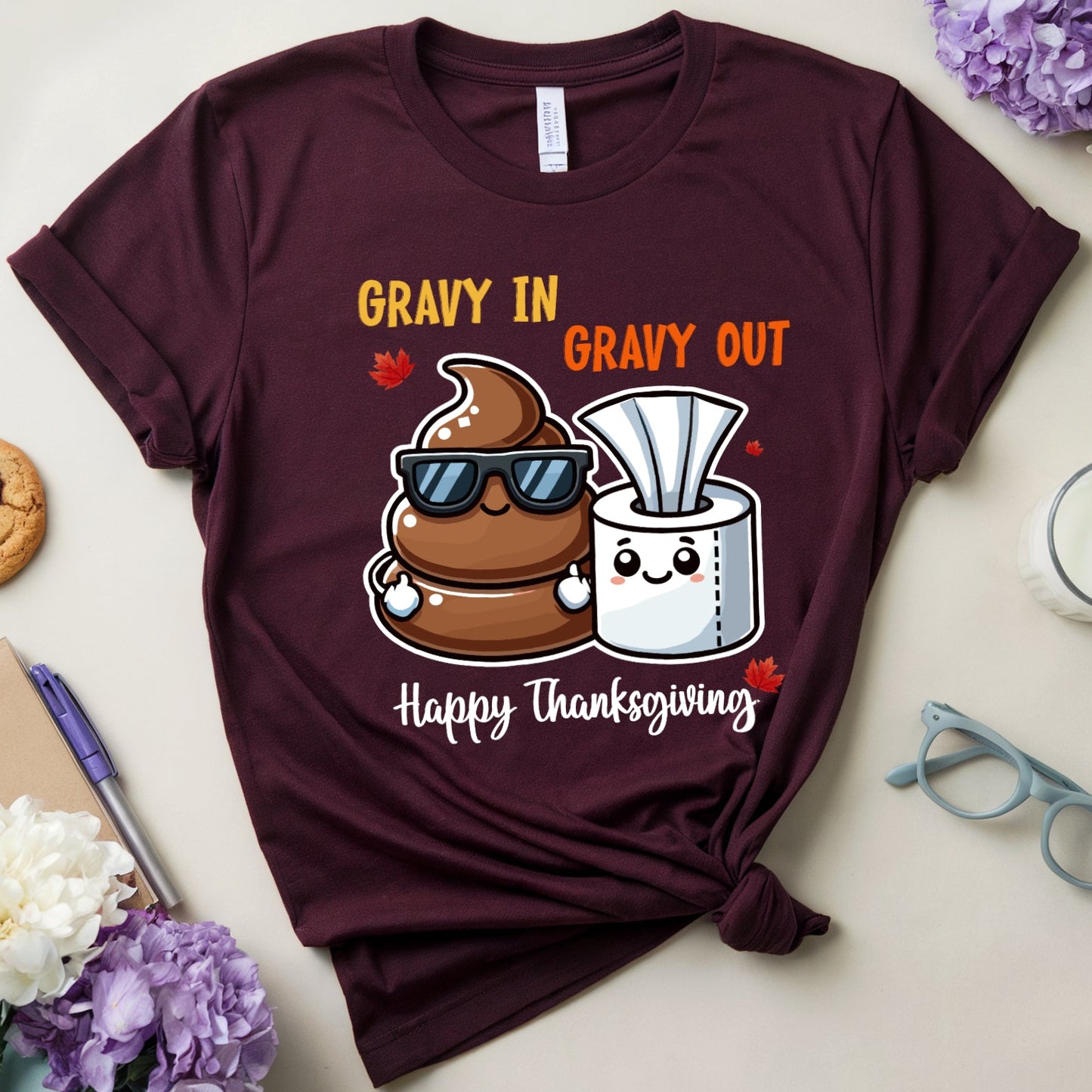 Maroon t-shirt with Thanksgiving-themed design about poop and tissue paper.
