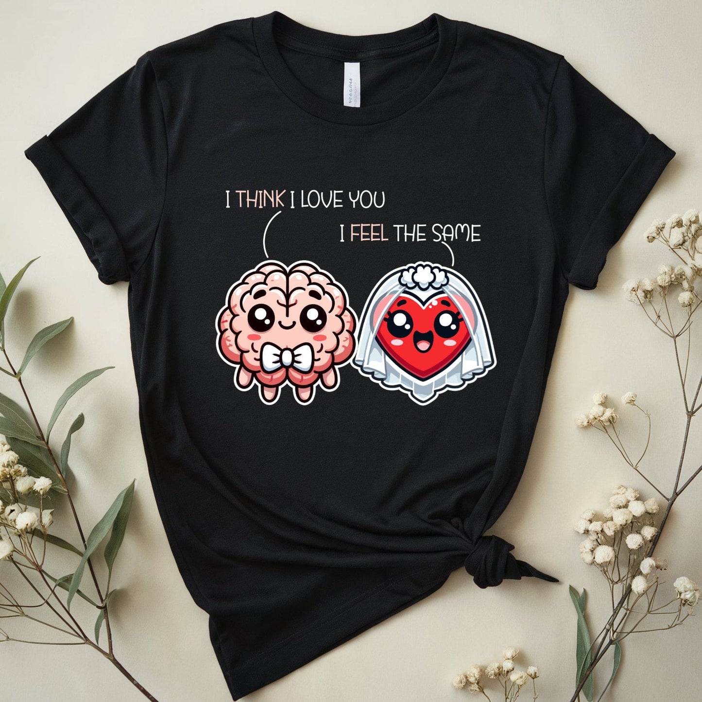 Black t-shirt with cartoon brain and heart design on a light background