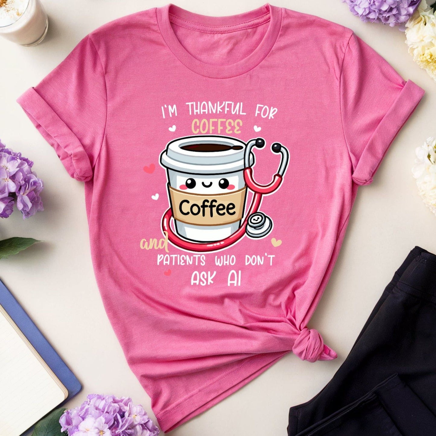 a heather pink  tshirt with the words 'I'm thankful for coffee and patients who don't ask AI' a funny thanksgiving gift for doctors, nurses or medical students.