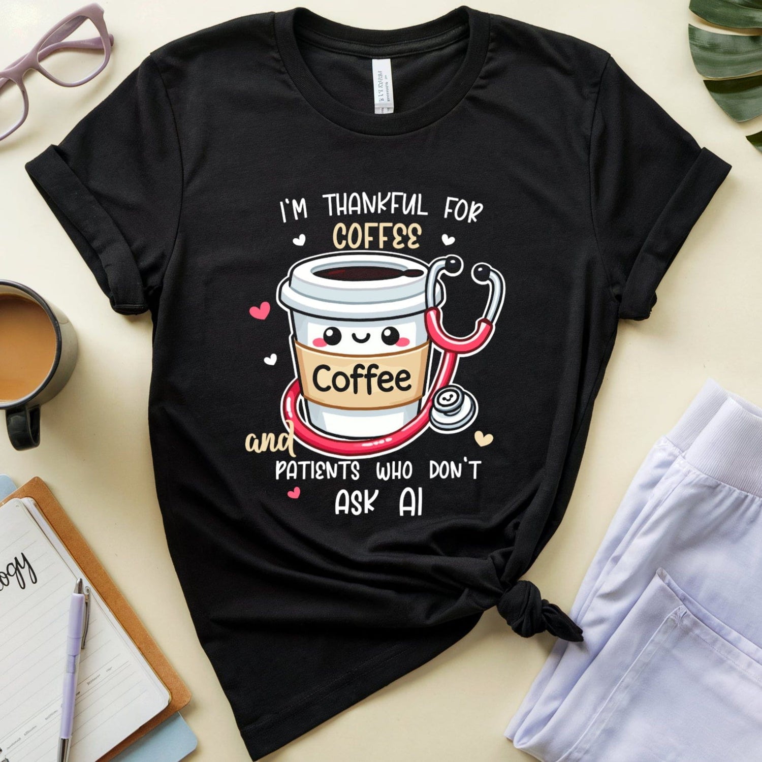 a black tshirt with the words 'I'm thankful for coffee and patients who don't ask AI' a funny thanksgiving gift for doctors, nurses or medical students.