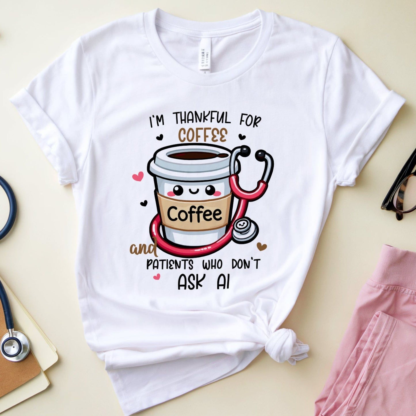 a white  tshirt with the words 'I'm thankful for coffee and patients who don't ask AI' a funny thanksgiving gift for doctors, nurses or medical students.