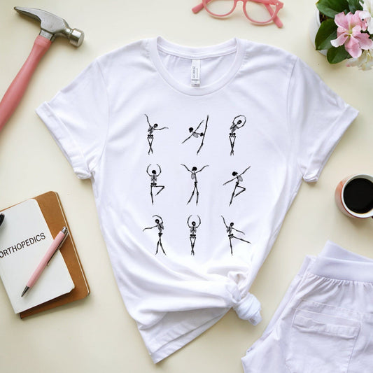 White t-shirt with skeleton ballerina design  for orthopedics on a light surface with accessories.