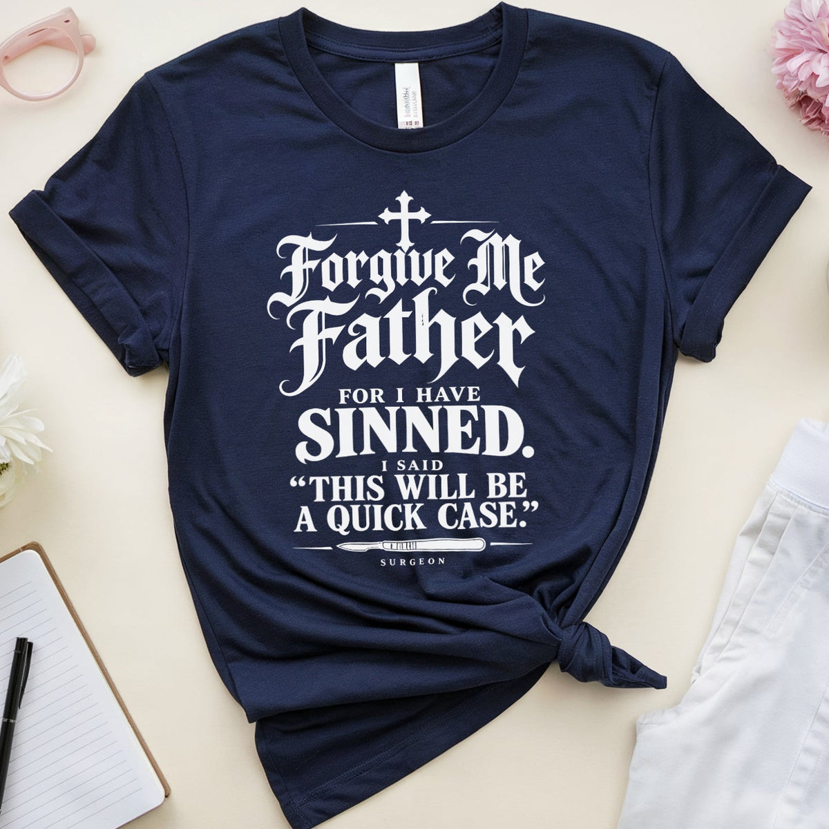 A navy blue graphic t-shirt with a white gothic-style text print reading 'Forgive Me Father FOR I HAVE SINNED. NOT THIS WILL BE A QUICK CASE.