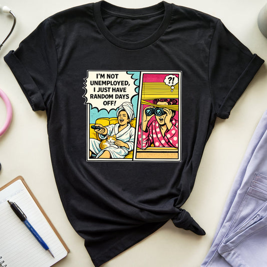 Black t-shirt with a graphic design on a light surface with a stethoscope, notebook, and coffee mug.
