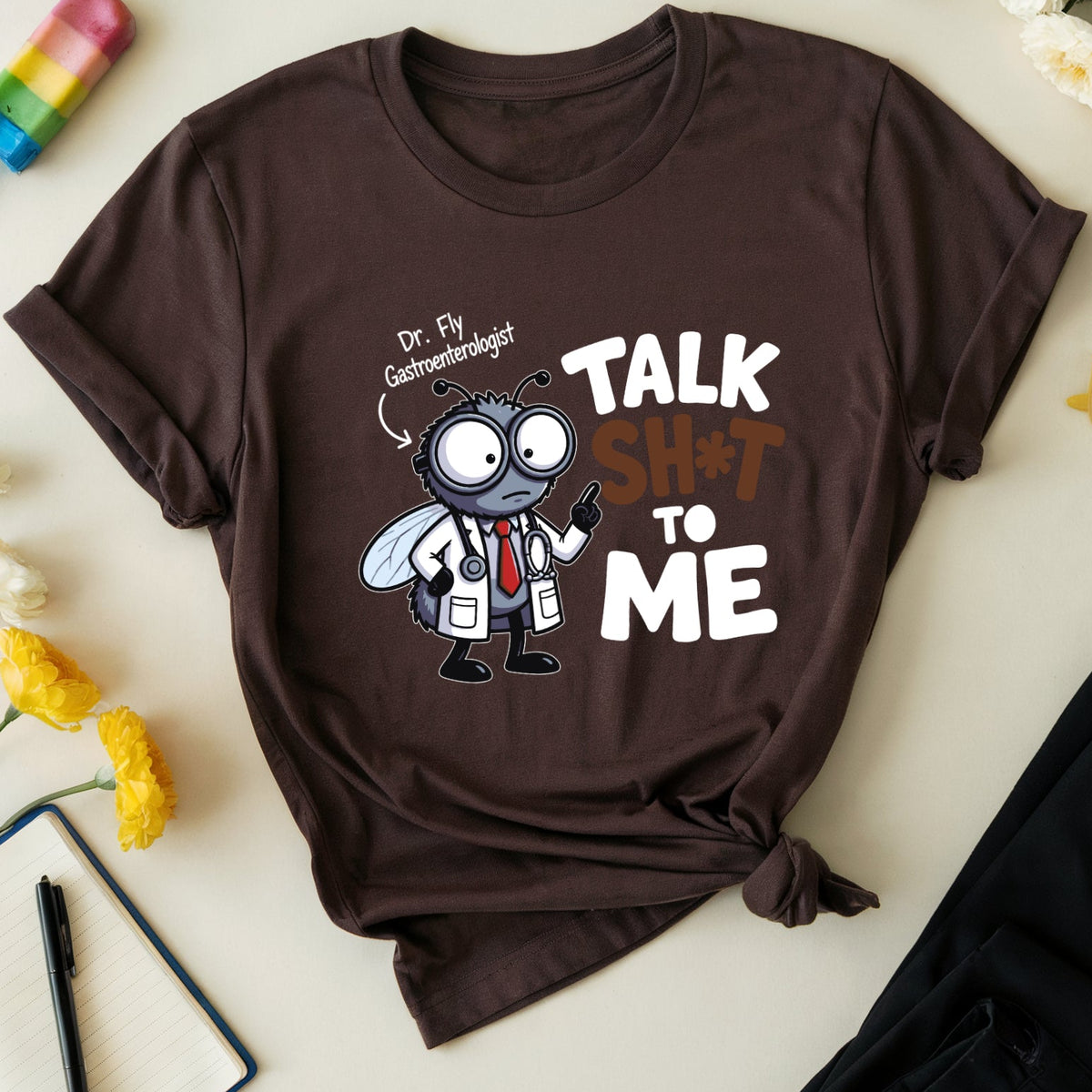 A dark brown graphic t-shirt featuring a cartoon fly dressed as a doctor and the text 'Dr. Fly Gastroenterologist' and 'TALK SHOT TO ME'.