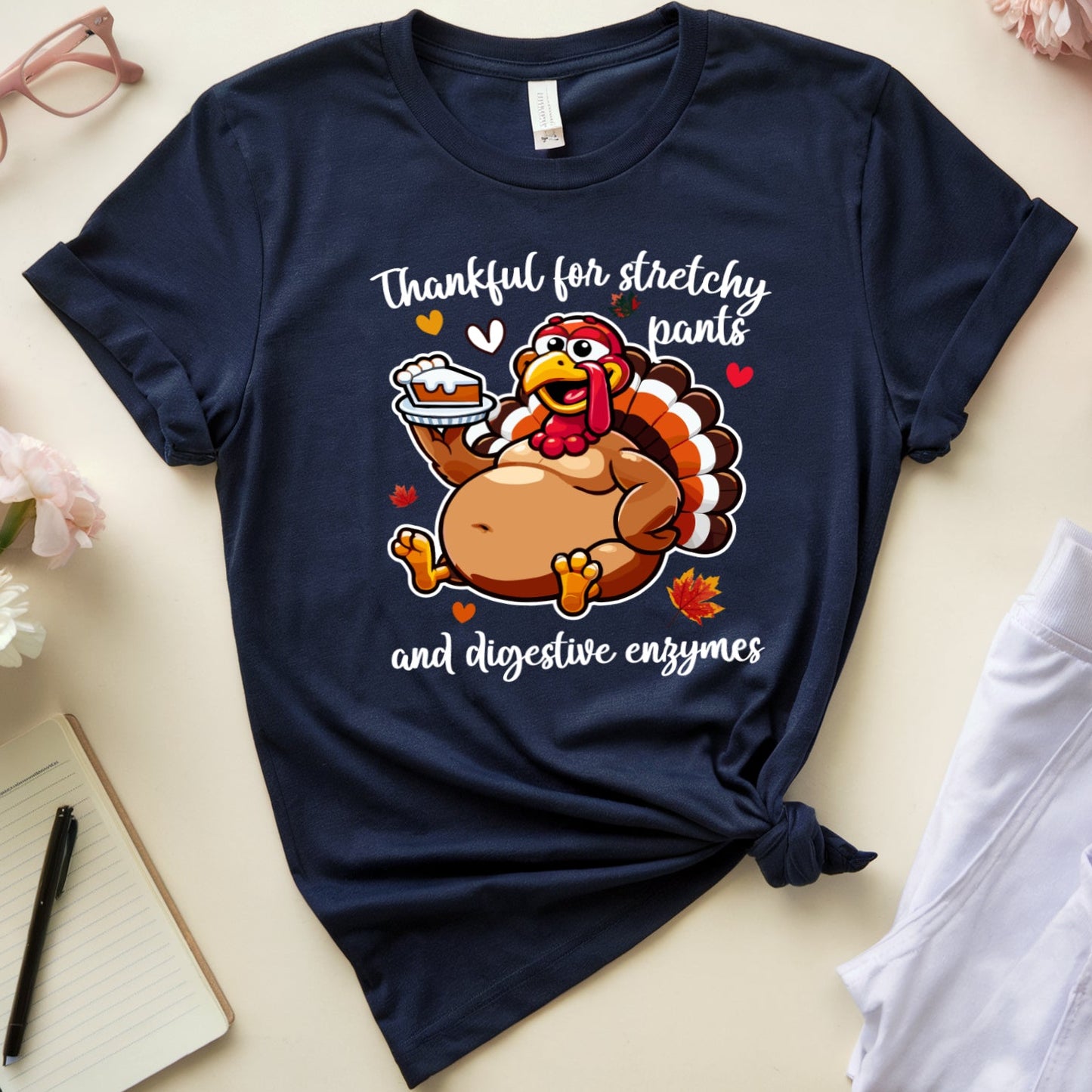 Navy blue t-shirt with a turkey graphic for Thanksgiving dinner with the words "thankful for stretchy pants ad digestive enzymes"